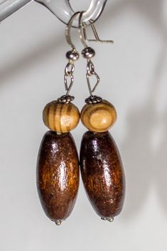 These are handmade natural earrings made of wood with metal ear-wires.                                          It is lightweight and comfortable antique style , modern earrings.                               Made of various natural wood and metal details, stone and crystals.                                                                    Hand crafted is an individual design that you will not find anywhere else. Artisan Brown Beaded Earrings For Pierced Ears, Brown Wooden Bead Earrings As A Gift, Brown Earrings With Wooden Beads As Gift, Mahogany Wooden Beads Jewelry, Mahogany Colored Wooden Bead Jewelry, Brown Wooden Beads Beaded Earrings As A Gift, Rustic Natural Wood Jewelry, Brown Beaded Earrings With Wooden Beads For Gift, Brown Wooden Beaded Earrings As Gift