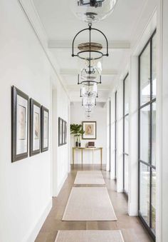 the hallway is clean and ready for guests to use it as an entrance way in this home