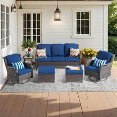 an outdoor patio with blue cushions and furniture