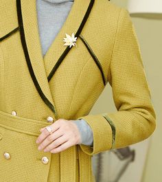 This elegant mustard pantsuit comes with a waist-sash blazer and flare-bottom pants for a sophisticated aesthetic that can be styled in endless ways. Black trim on collars and sleeves Blazer: Lined, double-breasted button closure Blazer: Long sleeves, shawl collar, front flap pockets Pants: Zip fly with hook-and-button closure Pants: Front slant pockets 50% wool,50% polyester Dry Clean Item #2816 Women's blazer & pant two-piece set SIZE INFO XS=US2=UK6=EU32 S=US4-6=UK8-10=EU34-36 M=US8-10=UK12-1 Shawl Collar Blazer, Waist Sash, Wool Suit, Suits Coats, Pocket Pants, Wool Blazer, Black Trim, Shawl Collar, Flare Pants