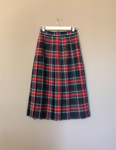 "Authentic vintage pleated plaid skirt. High waisted and longer in length. Waistband has elastic on each side for added comfort. Button and zipper closure in back. Skirt is in excellent, like new, clean condition with very little to no signs of previous wear. Measurements (taken zipped or buttoned up and laid comfortably flat) x2 inches Willow Ridge Tag Size 6P Made in USA Waist 25\"-27\" Hips 38\" Length 31\" All items are free of rips, tears, holes, and stains. Vintage items are subject to sig Plaid Pleated Skirt For School In Fall, Fitted Plaid Skirt For School, Fall School Uniform Lined Skirt, Fall Pleated School Uniform Bottoms, Fall School Uniform Style Pleated Bottoms, Plaid Skirt For School In Fall, Fall School Uniform Pleated Bottoms, Pleated School Uniform Bottoms For Fall, Plaid Bottoms For School In Fall