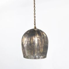 a metal light hanging from a chain