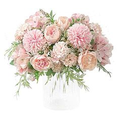 a vase filled with lots of pink flowers