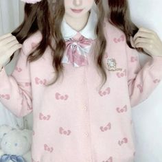 Womens Kawaii Sanrio Oversized Hello Kitty Cardigan Indulge in the spirit of kawaii fashion with our Women's Kawaii Sanrio Hello Kitty Oversized Pink Cardigan, a delightful addition to any cutecore wardrobe. Crafted from soft, cozy knit fabric, this Hello Kitty cardigan envelops you in comfort while exuding undeniable charm. Adorned with a playful bow pattern, this oversized pink cardigan features an adorable Hello Kitty patch on the chest, adding a touch of whimsy to every ensemble. Perfect for Pink Kawaii Sweater For Spring, Cute Spring Cardigan For School, Cute Long Sleeve Sweater For School, Pink Kawaii Long Sleeve Sweater, Pink Long Sleeve Kawaii Sweater, White Kawaii Cardigan, Cute Long Sleeve Cardigan, Cute Pink Sweater With Cartoon Print, Cute Cartoon Print Spring Sweater