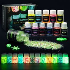 glow in the dark artisans kit with bottles and fluorescent pigments on black background