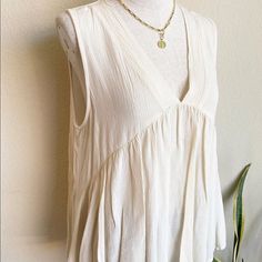 Sleeveless Ivory Top 100% Rayon. Just Bought At Local Boutique Never Been Worn Beige Tank Top For Daywear, Feminine Cream Tank Top For Spring, Chic Beige Tank Top For Daywear, Chic Cream Tank Top For Spring, Beige Sleeveless Tank Top For Daywear, Feminine Sleeveless Cream Blouse, Feminine Cream Sleeveless Blouse, Feminine Sleeveless Off White Top, Beige Sleeveless Blouse For Beach