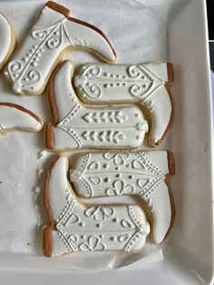 decorated cookies in the shape of horses on a tray