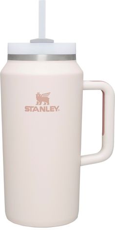 the stanley coffee mug is white and has a stainless steel lid with a plastic handle