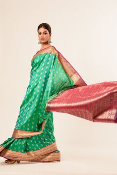 The classic Kanjivaram Silk Saree features a beautiful green color adorned with a delicate floral jaal design, a product that combines traditional artistry with modern sophistication. This handwoven Kanjivaram silk material adds a touch of elegance, while the contrast purple and gold zari woven border adds a pop of color and opulence. Transitional Green Cutdana Traditional Wear, Green Dupatta With Zari Work, Festive Green Chandbali Dupatta, Green Anarkali Traditional Wear With Zari Work, Green Chanderi Traditional Wear For Navratri, Green Cutdana Traditional Wear For Eid, Green Cutdana Traditional Wear For Festive Season, Green Anarkali Traditional Wear For Diwali, Festive Green Cutdana Traditional Wear