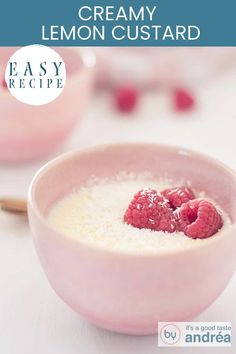 A pink bowl filled with lemon custard and raspberries. A text on top, creamy lemon custard, easy recipe