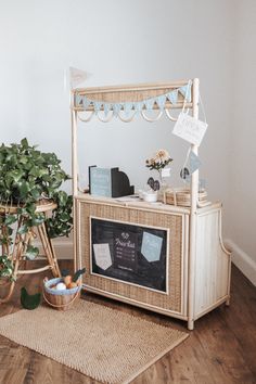 a small bar in the corner of a room with potted plants next to it