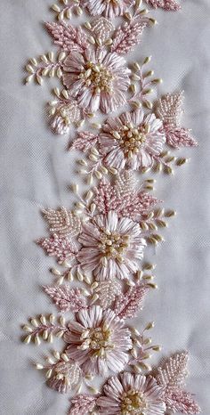 pink and white flowers with pearls on the bottom are shown in this embroidery work pattern