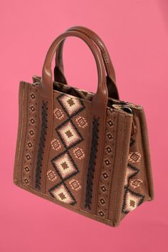 A stunning piece that is sure to turn heads, this hand bag shows off a distinctive boho western pattern square bag design. This hand bag is the perfect way to add a touch of elegance to any outfit. Length: 10 Inches Depth: 4.5 Inches Height: 8.5 Inches 100% Polyester. Bohemian Rectangular Shopping Bag, Brown Square Satchel With Handles, Brown Square Box Bag With Handles, Brown Rectangular Satchel With Handles, Brown Square Bag With Handles, Bohemian Rectangular Hobo Bag For Shopping, Bohemian Large Capacity Rectangular Satchel, Square Brown Hobo Bag With Handles, Brown Square Bag With Adjustable Handle