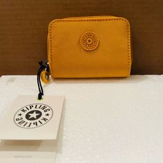 Kipling Women's Tops Wallets Color Spicy Gold. About This Item All-Round Zip And Snap Closure 2 Compartments For Coins 2 Compartments For Bills 4 Card Slots 1 Transparent Card Slot Casual Wallet For Gift, Casual Bifold Coin Purse, Casual Coin Purse With Interior Card Slots, Trendy Yellow Wallet For Everyday Use, Yellow Casual Wallet For Everyday Use, Trendy Yellow Wallets For Everyday Use, Casual Bifold Travel Coin Purse, Yellow Coin Purse For Everyday Use, Casual Coin Purse With Interior Card Slots As Gift