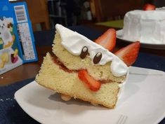 a piece of cake with strawberries on top