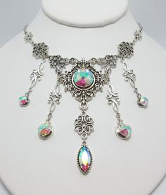 "This is a new handmade necklace. It is made with antiqued silver plated filigrees, accented with high quality CRYSTAL CLEAR AB glass jewels/rhinestones that sparkle like crystals. Decorated portion is 6 1/2\" wide and 3 1/4\" tall in the center. Necklace is adjustable 15-18\" with a lobster clasp and chain extender. If you would like a different length, please send us a message. Matching earrings and headpiece are listed in our store." Gothic Silver Necklaces For Festival, Gothic Silver Jewelry For Festival, Adjustable Silver Jewelry For Fantasy Events, Silver Decorative Jewelry For Festivals, Festival Decorative Silver Jewelry, Silver Gothic Jewelry For Jewelry Making, Silver Gothic Jewelry For Fantasy Events, Silver Bohemian Jewelry For Fantasy Events, Silver Steampunk Jewelry For Party