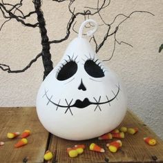 a halloween decoration with candy corn and a jack - o'- lantern