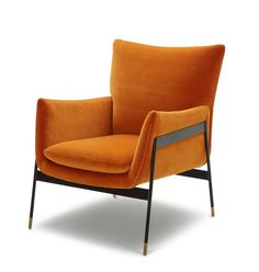 an orange chair sitting on top of a white floor next to a black metal frame