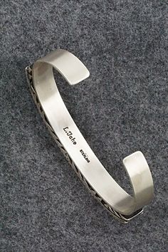 This sterling silver bracelet was made by Navajo silversmith Leander Tahe. The inside is signed L. Tahe and stamped sterling.Size: 5 3/4" (will fit up to a 7 1/8" wrist)Gap: 1 3/8"Width: 3/8"Free shipping on all orders! We ship with USPS and always include tracking. All orders ship within a day of payment.Returns are accepted up to 30 days after you receive your order. Just send us a message. Our shop offers cash back or store credit. The item must be returned in new condition. Southwestern Engraved Sterling Silver Bracelet Gift, Engraved Sterling Silver Bracelet Gift, Bling Things, Sterling Silver Bracelet, Native American Jewelry, Free Jewelry, Sterling Silver Bracelets, Silver Bracelet, Gap