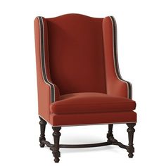 an upholstered red chair with black trim