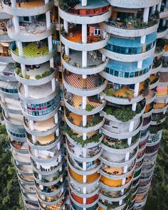 an aerial view of a tall building with balconies