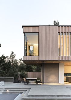 a modern house with stairs leading up to it