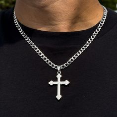 This elegant medium solid crucifix pendant is a timeless and versatile accessory that can be worn for any occasion. It is made of silver-plated alloy and comes with a 5mm Cuban chain or 4mm Rope chain. The pendant is approximately 1.5 inches wide and 2 inches long. Features: Chain Length - Cuban Chain- 22 inches - Rope Chaim- 20 inches - Material: Silver plated alloy - Dimensions: Approx. 1.5 inches width and 2 inches length - Includes: 5mm Cuban chain or 4mm Rope chain - A thoughtful gift for a Silver Pendant Cross Necklace, Silver Cross Necklace With Adjustable Chain, Silver Crucifix Figaro Chain Jewelry, Silver Crucifix Necklace With Figaro Chain, Silver Metal Cross Necklace, Silver Figaro Chain Necklace With Cross Pendant, Silver Cross Necklace With Figaro Chain, Silver Cross Necklace With Figaro Chain As Gift, Silver Necklace With Figaro Chain And Cross Pendant