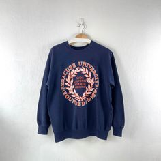 Vintage 90s Syracuse University Crewneck Sweatshirt  Condition : Used vintage Good conditions Details : 1 hole (Look at the picture) Please Let me know if you have any      questions or More Photo Detail Brand : BW Made in : USA 🇺🇸  Measurement Size On Tag : XL, (fit like L) Pit to pit : 23.5 inches Length : 26.75 inches Material : Cotton Polyester Color : Blue *Please keep in mind that our items are vintage so they may show some signs of wear and tear *Please read everything before buying  No Cancel  No Refund  No Return  payment Accept PayPal only. Please give us your phone number together with address after you purchasing.( No P.O Box  shipping to worldwide Item will shipped in 1-3 days after payment. ( remote area The shipping cost is higher) Thank you :) 90s Style Crew Neck Sweatshirt With Screen Print, 90s Crew Neck Sweatshirt With Screen Print, 90s Graphic Print College Sweatshirt, 90s Graphic Print Sweatshirt For College, 90s College Sweatshirt With Graphic Print, Vintage Cotton Sweatshirt For Campus, College 90s Graphic Print Sweatshirt, Vintage Cotton Sweatshirt With Graphic Print, Vintage Graphic Print Sweatshirt For Campus