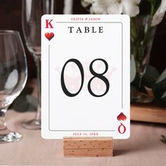 a table number is displayed with wine glasses