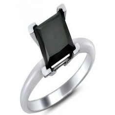 a white gold ring with a black diamond