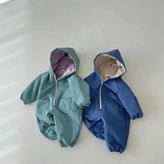 Wrap your baby in warmth with our Warm Hooded Fleece Romper! ❄️ Ideal for 6-24 months, this unisex romper is perfect for winter. Soft cotton and a hooded design make it a cozy choice for baby winter outfits! #BabyWinterWear #FleeceRomper #UnisexBabyClothes Winter Cotton Onesie, Cozy Solid Color Onesie For Winter, Cozy Solid Onesie For Winter, Casual Jumpsuits And Rompers For Winter Playtime, Long Sleeve Onesie For Winter Playtime, Long Sleeve Onesie For Playtime In Winter, Winter Onesie For Playtime, Winter Playtime Solid Onesie, Winter Playtime Solid Color Onesie