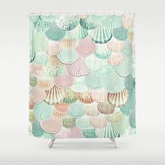 colorful seashells shower curtain with pastel colors on the bottom, and an aqua green background