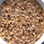 a white bowl filled with black eyed peas