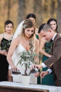 a bride and groom cutting their wedding cake