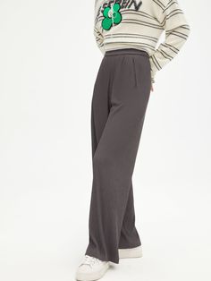 Details: Unique casual pants in smoky gray Made of high quality polyester with spandex, imported pleating machine, soft and smooth hand feeling Elastic waistband, side pockets Loose leg Materials & Care: Polyester Fiber 97.4%, Spandex 2.6% Hand wash | Dry clean Do not bleach Size & Fit: Model is 5'7", Bust 32, Waist 24, Hips 35, wearing a size S Item #: LM3PA18 Gray Wide-leg Bottoms With Ribbed Waistband, Gray Wide Leg Bottoms With Ribbed Waistband, Gray Pants With Ribbed Waistband For Fall, Gray Fall Pants With Ribbed Waistband, Fall Gray Pants With Ribbed Waistband, Gray Straight Pants With Elastic Waistband, Gray Pants With Elastic Waistband, Gray Stretch Wide Leg Ankle-length Pants, Chic Gray Bottoms With Elastic Waistband