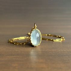 Dreamy sage green light beams from within this entrancing moonstone, grasped by Rosanne Pugliese's stunning scallop prong setting. 18k yellow gold Moonstone 12mm x 19mm (1/2" x 13/16") Pendant can be purchased alone or with the following chain options: • 22k yellow gold link chain, 18" long • 14k medium link chain, adjustable 17.5" & 19" • 14k medium link chain, adjustable 18.5" & 21" • 14k fine chain, adjustable 18" & 22" Elegant Gold Moonstone Ring With Natural Stones, Elegant Yellow Gold Moonstone Ring With Large Stone, Oval Moonstone Yellow Gold Jewelry, Yellow Gold Moonstone Jewelry With Oval Shape, Elegant Prehnite Gemstone Jewelry, Ethereal Oval Moonstone Jewelry, Elegant Oval Moonstone Chalcedony Ring, Elegant Untreated Oval Pendant Jewelry, Elegant Untreated Moonstone Ring