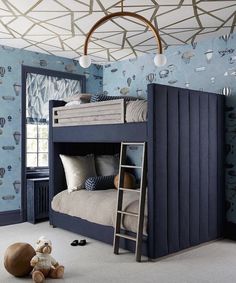 a bedroom with blue walls and a bunk bed