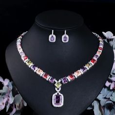 Complete your wedding look with this elegant Bridal Necklace and Earring Jewelry Set. The set is designed to add a touch of sophistication and style to your bridal ensemble, making you shine on your special day.
– This bridal a plus cubic zirconia gemstone necklace set is perfect for adding elegance to any bridal ensemble.– Made with high-quality materials, this set includes a stunning necklace and matching earrings for a complete look.– Perfect for pageant, bridal, bridesmaid, prom, quinceañera African Style Necklace, Purple Jewelry Set, Prom Jewelry Sets, Engagement Necklaces, Diamond Jewelry Set, 18k Gold Necklace, Purple Jewelry, Prom Jewelry, Fashion Jewelry Sets