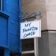 a sign that says my favorite cookie hanging from the side of a building