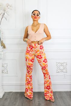 Fashion-forward floral fans, rejoice! Our Floral Arrangement Bell Bottoms provide the perfect blend of statement-making style and comfy-cozy coziness. These bell bottoms boast buttery-soft fabric that'll feel like a breath of fresh air in any wardrobe. Take a 'flower' out of our book - get your hands on a pair today! Paired with our APRICOT SLEEVELESS BUTTON UP CLOSURE SWEATER TOP Model is 5’4 wearing a size small and in 3 1/2 inch heels Trendy Floral Print Bottoms For Loungewear, Fall Floral Print Loungewear Pants, Floral Print Loungewear Pants For Fall, Floral Print Bottoms For Fall Loungewear, Floral Print Fall Bottoms For Loungewear, Fall Floral Print Loungewear Bottoms, Floral Print Fall Loungewear Bottoms, Stretch Floral Print Loungewear Pants, Stretch Floral Print Pants For Loungewear