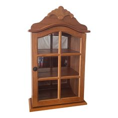 a wooden display case with glass doors on the top and bottom shelves, made out of wood