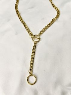 "Necklace comes in gold plated stainless steel or silver stainless steel. Necklace length around neck comes in 14.5\" - 17\" and drop is 4\". This solid and unique necklace is great alone or worn as a layering piece. Wear it as a necklace or as a lariat as shown in the photos! This necklace is a necklace that will dress up your outfit while giving you an edge. Great piece to add to your collection. Such a comfortable and amazing quality piece that you will reach for over and over! It is of great Modern Gold Lariat Necklace, Modern Gold Metal Lariat Necklace, Modern Gold Lariat Necklace With Adjustable Chain, Metal Lariat Necklace With Adjustable Chain, Metal Lariat Necklace With Chain Detail, Metal Lariat Necklace With Chain, Everyday Gold Chain Lariat Necklace, Everyday Gold Lariat Necklace With Lobster Clasp, Gold-tone Metal Lariat Necklace Gift