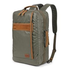 Discover the Madrone Coated Canvas Backpack, a perfect fusion of robust utility and sleek design for the modern-day explorer. Masterfully handcrafted, this backpack offers a durable sanctuary for your essentials, whether navigating urban jungles or wilderness trails. Made from high-caliber cotton canvas with genuine leather accents, it blends durability and elegance. The coated canvas exterior ensures longevity and protection, integrating 100% recycled nickel-free hardware and vegetable-based dyes for environmental sustainability. Each seam, zipper, and strap celebrates handcraftsmanship, providing optimum durability and style. | TSD Brand Madrone Backpack, Green Functional Rectangular Backpack For Hiking, Durable Modern Backpack For Everyday Use, Functional Waxed Finish Rectangular Backpack, Modern Outdoor Backpack With Luggage Sleeve, Modern Durable Standard Backpack, Modern Backpack With Functional Pockets For Outdoor, Outdoor Laptop Backpack With Luggage Sleeve, Modern Outdoor Backpack With Functional Pockets, Modern Backpack For Outdoor