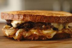 a grilled cheese sandwich with meat and onions