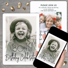 a hand holding an iphone next to two birthday cards