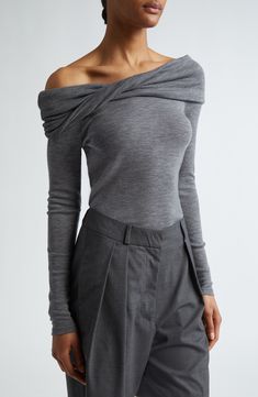 A graceful twist on the fold-over neckline adds interest to this soft wool top framed by svelte long sleeves. One-shoulder neck Long sleeves 100% wool Hand wash, dry flat Made in Portugal Frame Clothing, Luxury Elegant Gray Tops, Luxury Gray Winter Tops, Elegant Formal Merino Wool Tops, Elegant Merino Wool Tops For Work, Fitted Elegant Merino Wool Tops, Elegant Fitted Merino Wool Tops, Elegant Fine Knit Gray Top, Elegant Long Sleeve Merino Wool Top