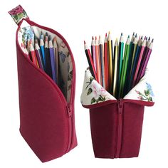 a red pencil holder filled with lots of colored pencils in it's pouch