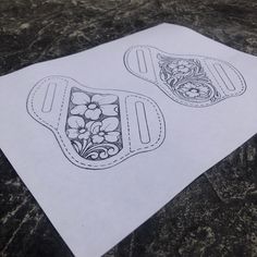 two paper pieces with flower designs on them