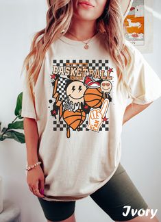 Basketball T Shirt ❤️ Every shirt is hand printed to order, we put so much love into making each shirt  ❤️ If for any reason the shirt didn't live up to your quality standards, contact us and we'll replace it or refund it ❤️ Feel free to send us your special request or if you have a unique idea for a shirt So it's that time again. You need to look for a new T-shirt to wear with your favorite jeans... for that effortless look 😥 You know, the kind that says I woke up like this but takes an hour to execute? 😓 There's no amount of effort you won't put in on your quest to look totally effortless.  After all, you want fashion's latest casual T, not casualty 🤕 Well this is that kind of T-shirt.  Natural and unrehearsed. Casual chic. It's effortless, but not without style 🤩 Wrapped around the Cotton Graphic Print Tops For Fans, Cotton Shirt With Funny Print For Fans, Cotton Tops With Funny Print For Fans, Graphic Tee Shirt With Funny Print For Fans, Trendy Screen Print Shirt For Fan Merchandise, Trendy Shirt With Fan Merchandise Screen Print, Cotton Band Merch Shirt With Funny Print, Cotton Shirt With Funny Print Band Merch, Trendy Fan Merchandise Shirt With Screen Print