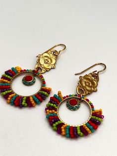 Colorful beaded brass earrings. These are lightweight one of a kind earrings that will go with all of your summer/spring outfits! Multicolor Brass Drop Earrings, Multicolor Bohemian Jewelry With Gold Beads, Bohemian Multicolor Jewelry With Gold Beads, Multicolor Dangling Beaded Brass Earrings, Beaded Brass Dangle Earrings, Multicolor Nickel-free Beaded Earrings For Festival, Bohemian Multicolor Brass Earrings, Multicolor Gold Beads Jewelry For Summer, Multicolor Gold Beaded Summer Jewelry